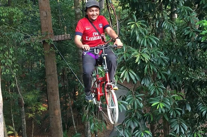 Ride a bike across a tightrope